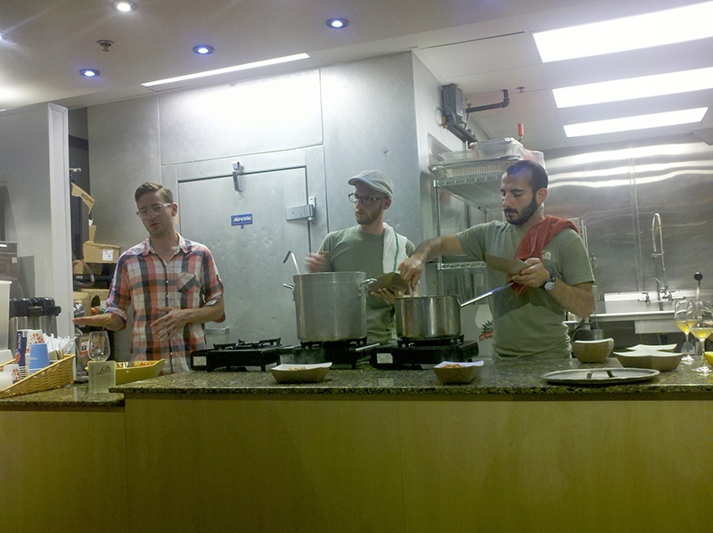(L-R) Evan Lewandowski, Derek Kitchen and Moudi Sbiety teach a class at Caputo's on Lebanese food and local wine.